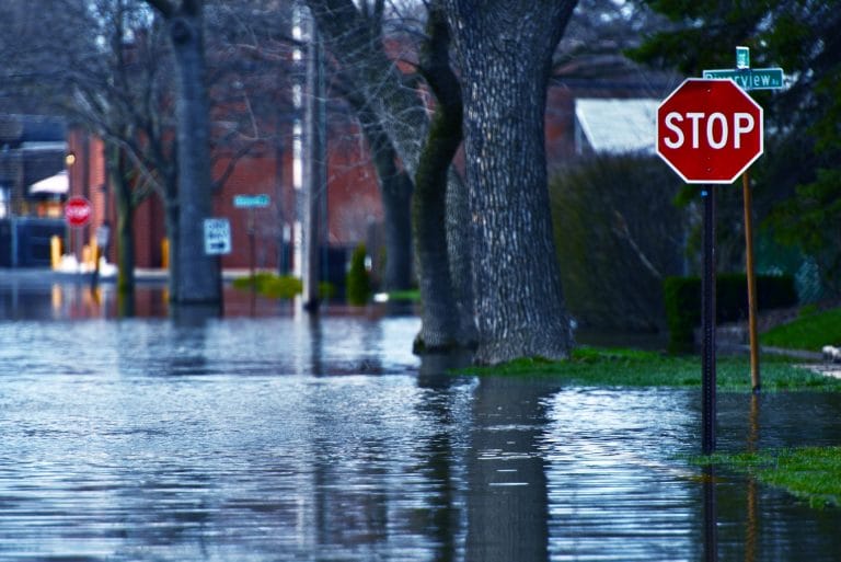 flooded road new stop sign