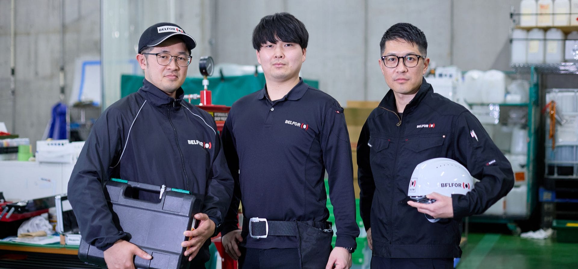 A groupd of BELFOR Asia employees holding equipment