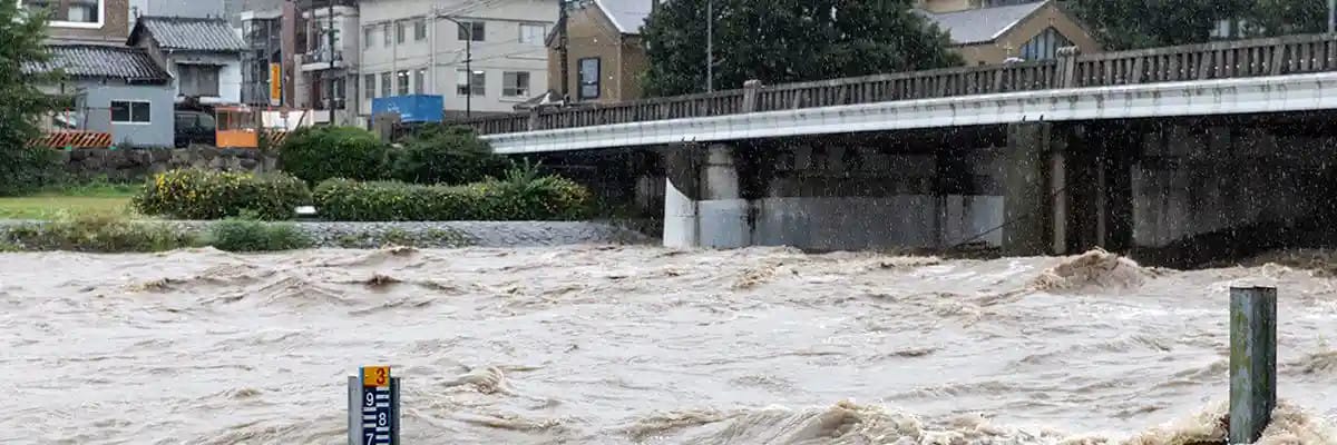 A high water river below a bridge