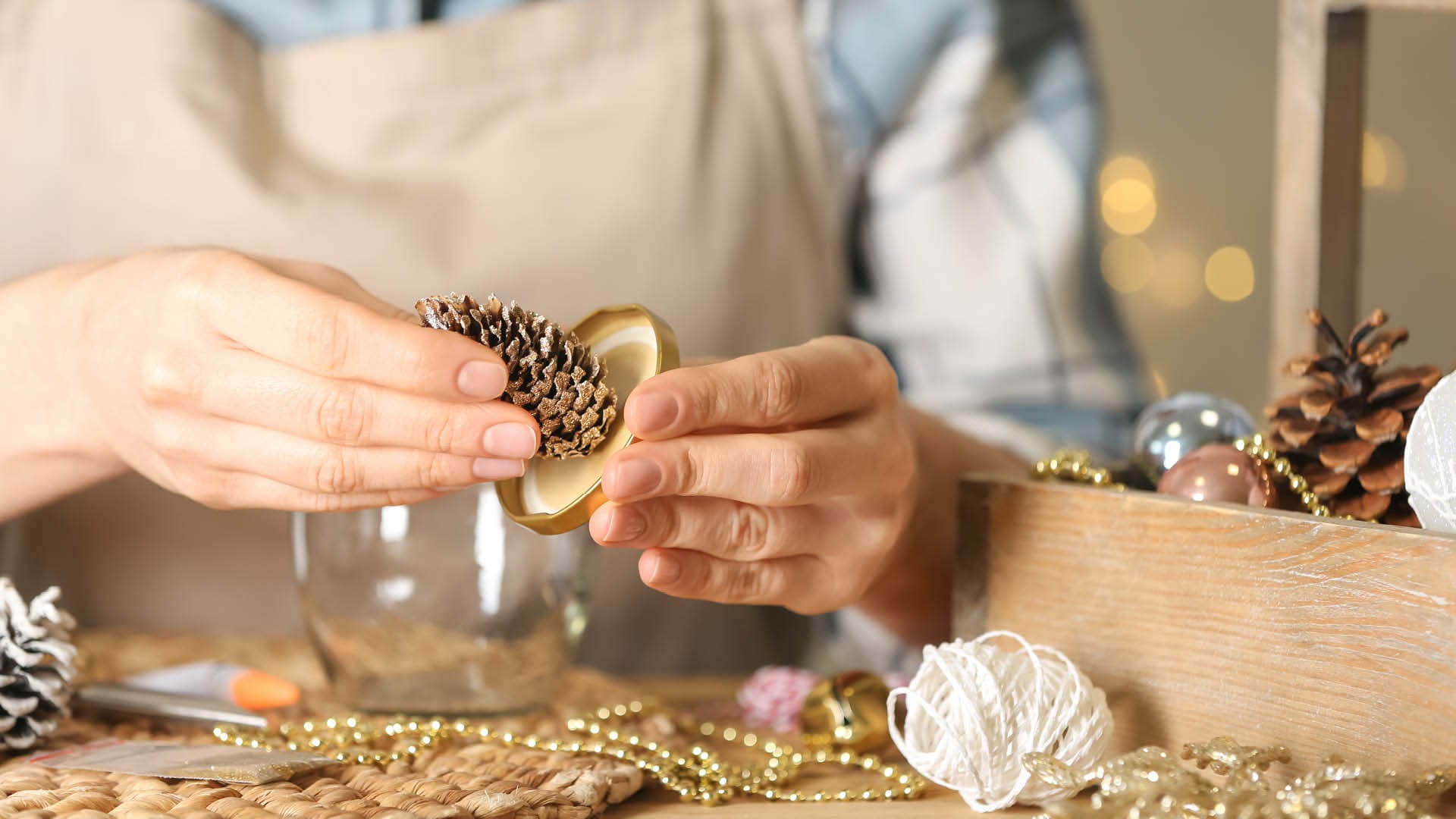 A person crafting a snow globe