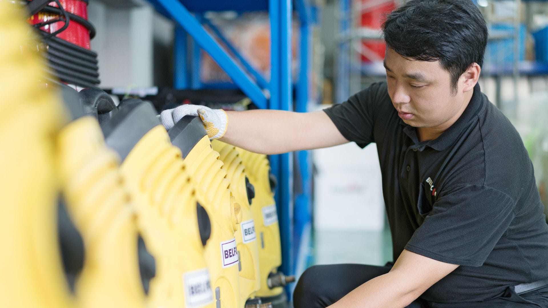 BELFOR employee checking drying equipment in workshop