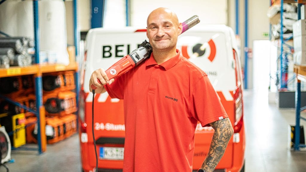 A BELFOR employee who is smiling