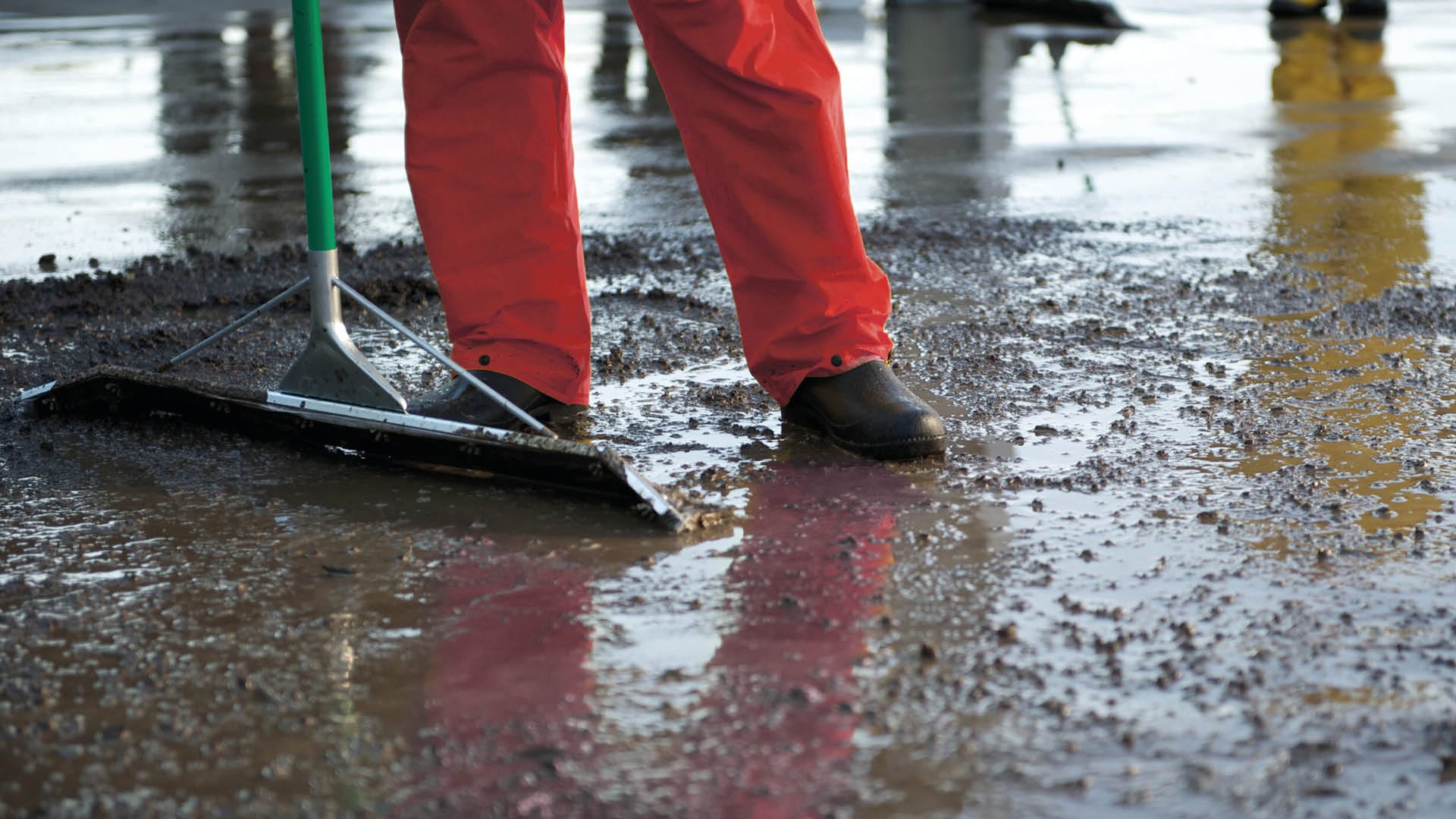 A rubber floor squeegee