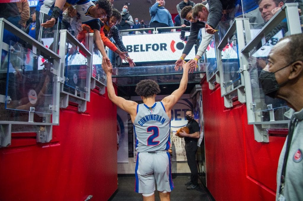 A basketball player with the BELFOR logo