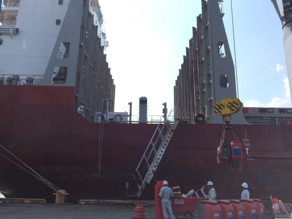 A ship with employees on the ground