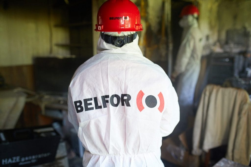 A BELFOR employee decontaminating a facility