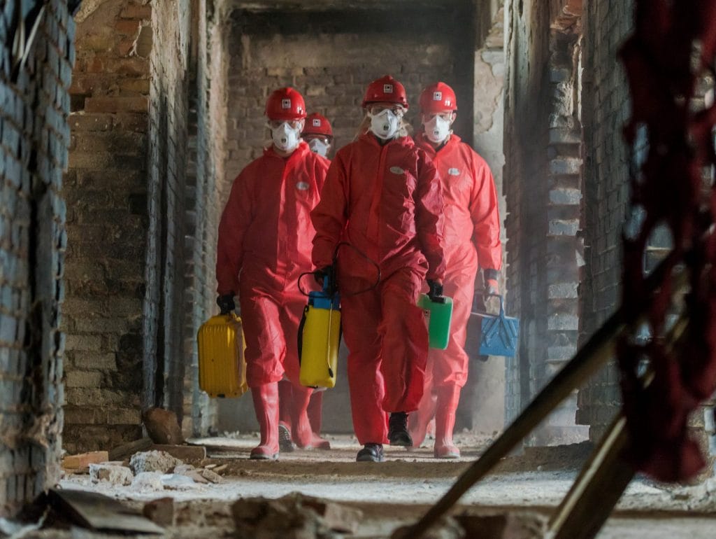 Belfor experts examining a building damaged by fire