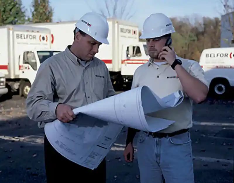 Belfor project managers looking at plans for property restoration after fire