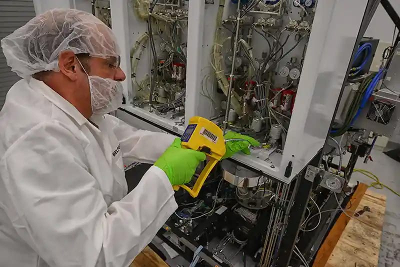 A BELFOR employee decontaminating semiconductors