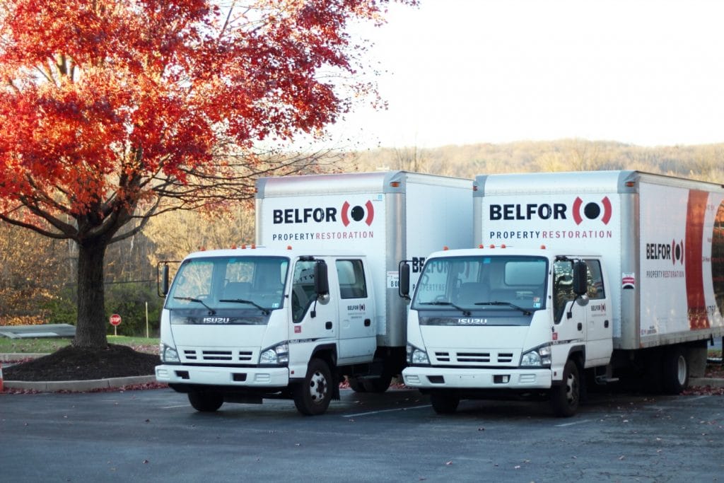 Two BELFOR trucks