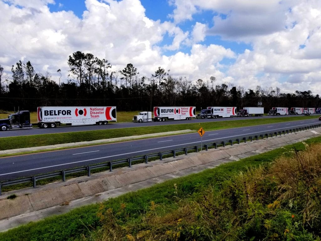 BELFOR trucks on the field