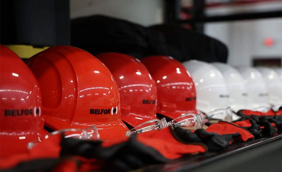 A collection of red and white fire hats​