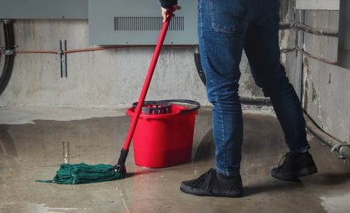 A person mopping on the floor