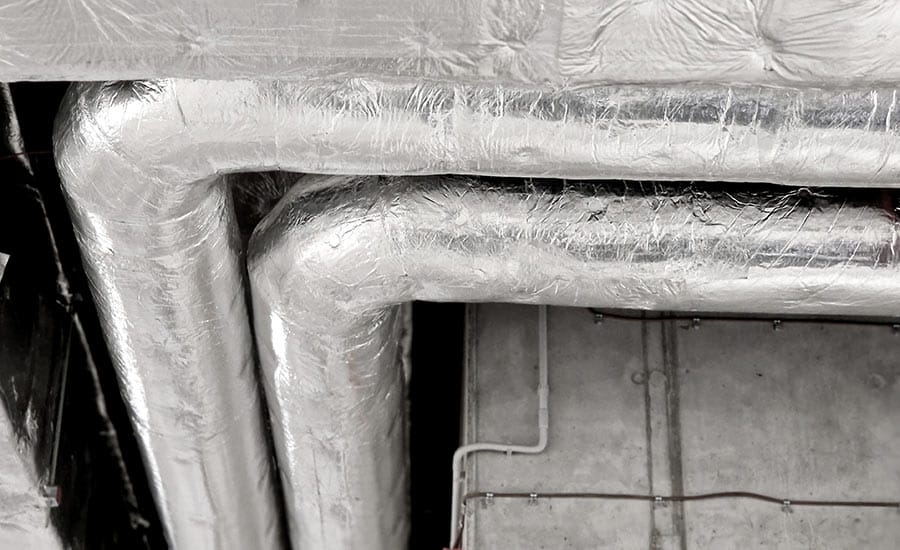 A close up of a pipe covered with aluminum foil​