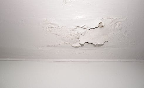 A white wall with moisture on it